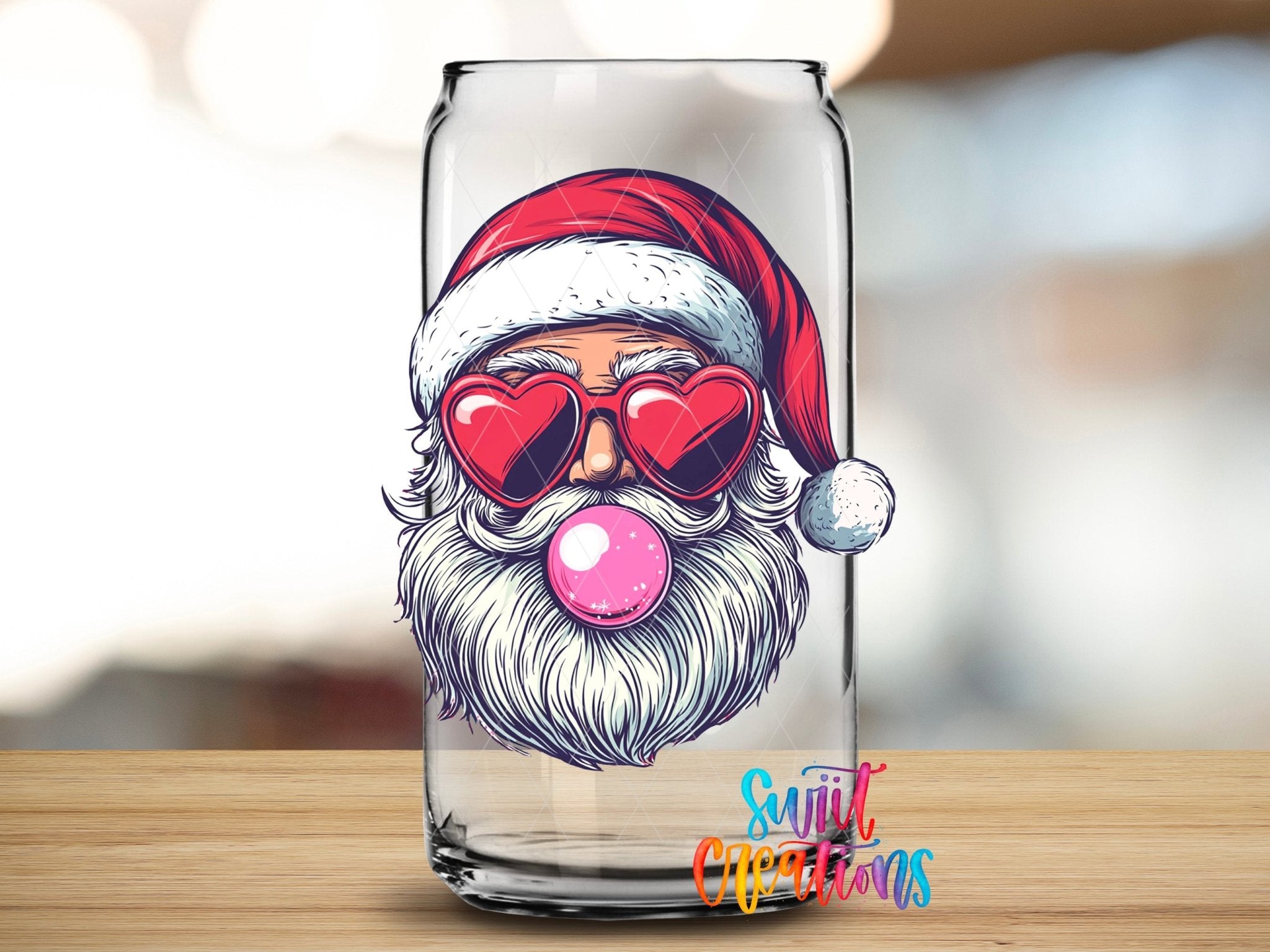 Swiit Creations UV DTF Retro Santa Heart Sunglasses Bubble Gum transfer applied to a clear glass can