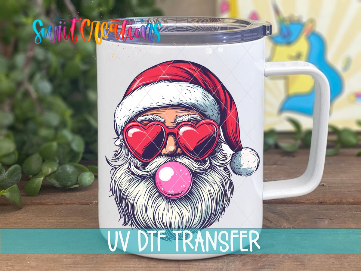 Bubble Gum Santa UV DTF transfer on a white stainless steel mug with a lid