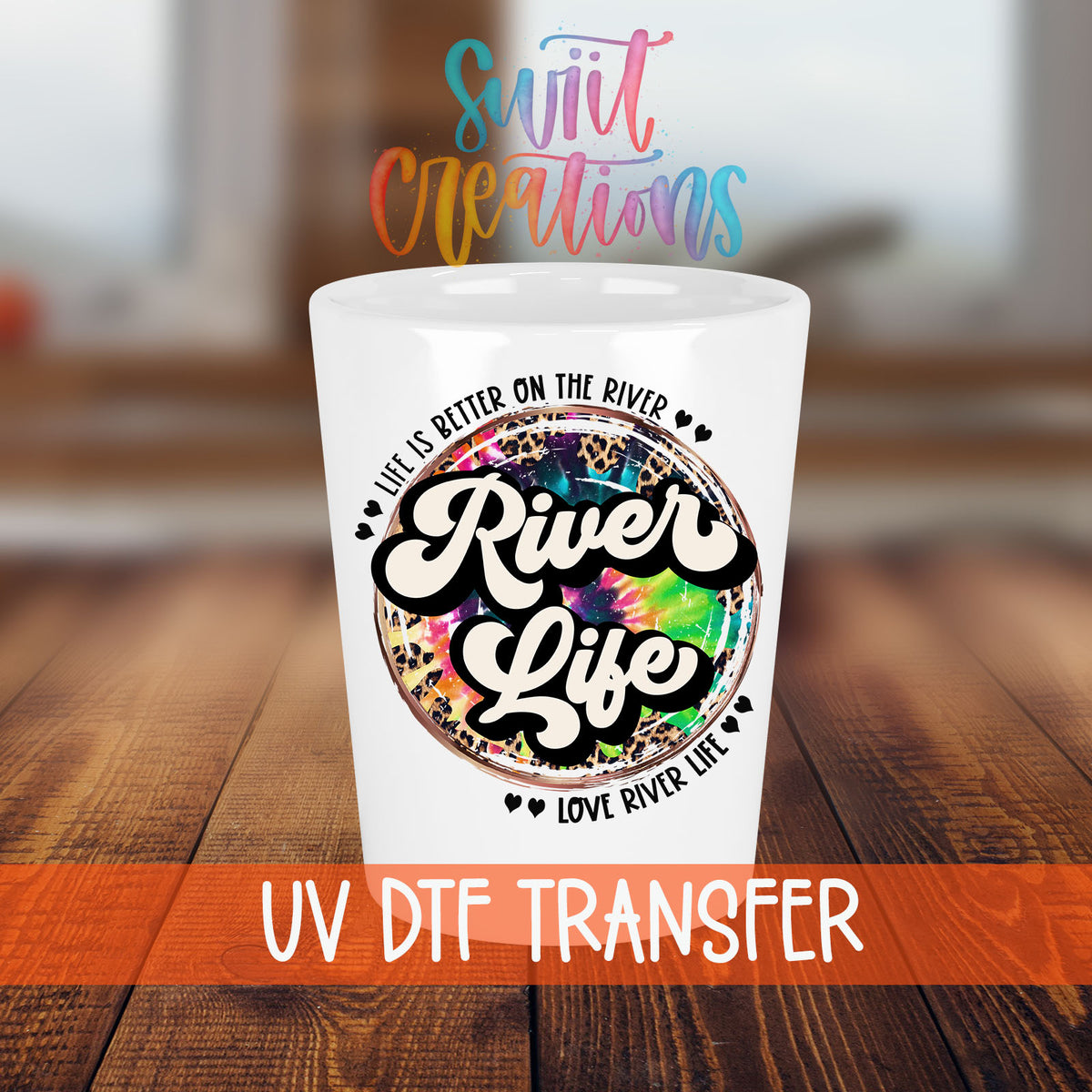 River Life shot glass transfer on a white shot glass on a wooden table