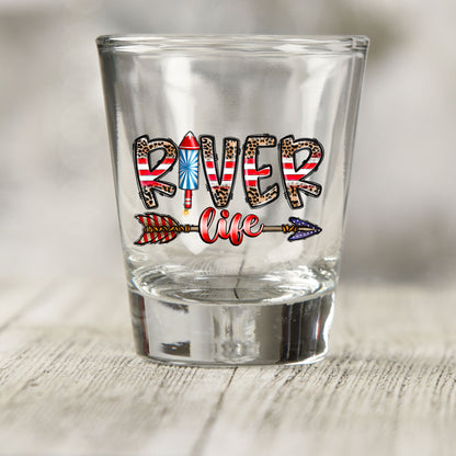 River Life USA shot glass UV DTF transfer with leopard print and striped lettering with a firework on a clear shot glass