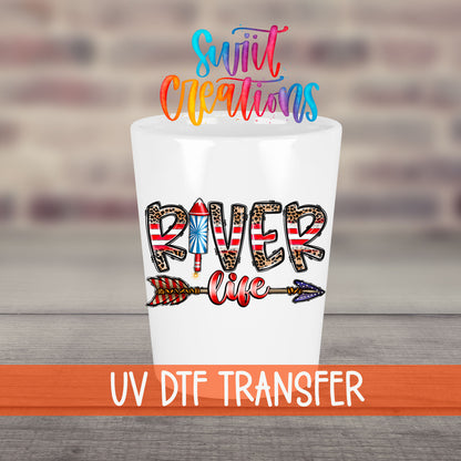 River Life USA UV DTF transfer on a white shot glass in front of a brick wall