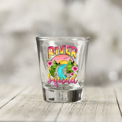 Close-up of the River Squad UV DTF transfer on a clear shot glass