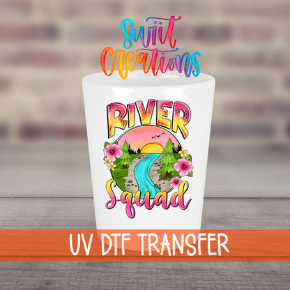 River Squad UV DTF transfer on a white shot glass in front of a brick wall