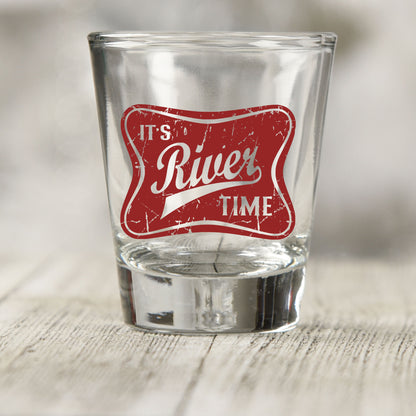 River Time shot glass UV DTF transfer with distressed vintage badge on a clear shot glass