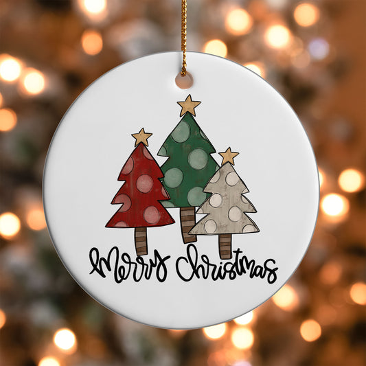 Rustic Tree Trio Merry Christmas ornament UV DTF transfer on a round white ornament with a bokeh light background