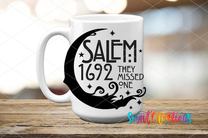Salem 1692 They Missed One UV DTF transfer on a white ceramic coffee mug