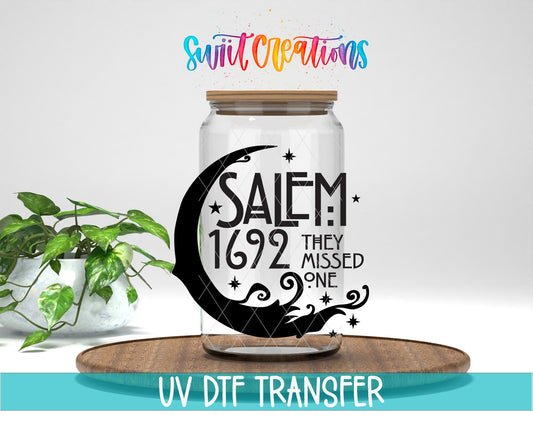 Salem 1692 They Missed One UV DTF transfer displayed on a clear jar mockup from Swiit Creations