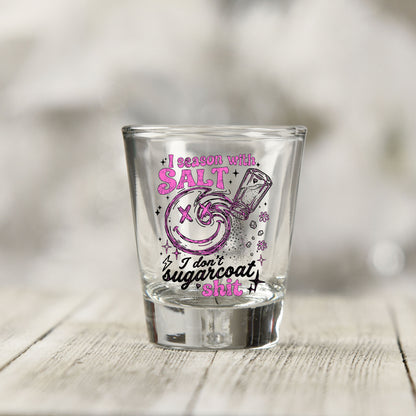 Close-up of the Salt Season Adult Humor UV DTF transfer on a clear shot glass