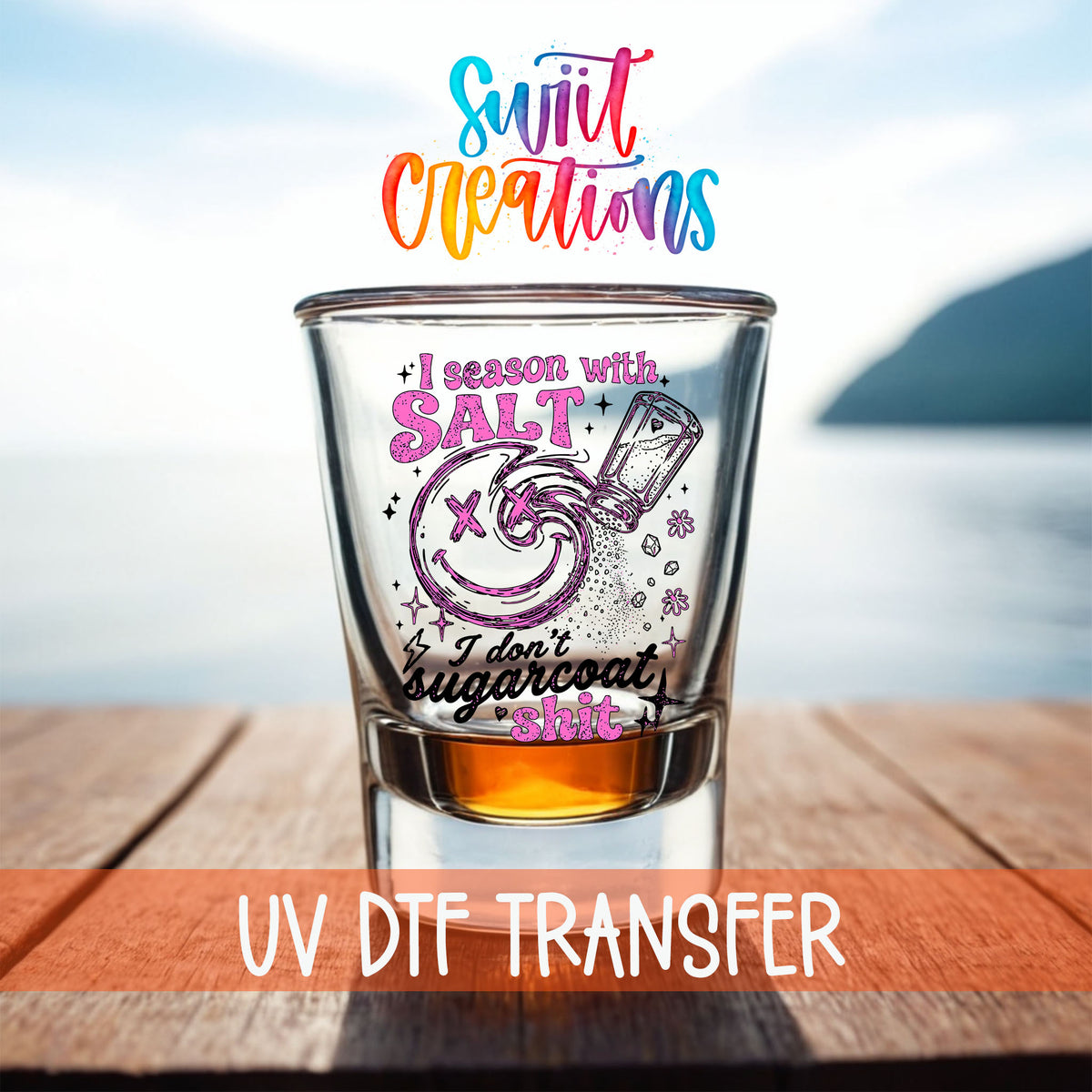Salt Season Adult Humor shot glass UV DTF transfer on a filled shot glass on a dock by the water