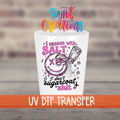 Salt Season Adult Humor UV DTF transfer on a white shot glass in front of a brick wall