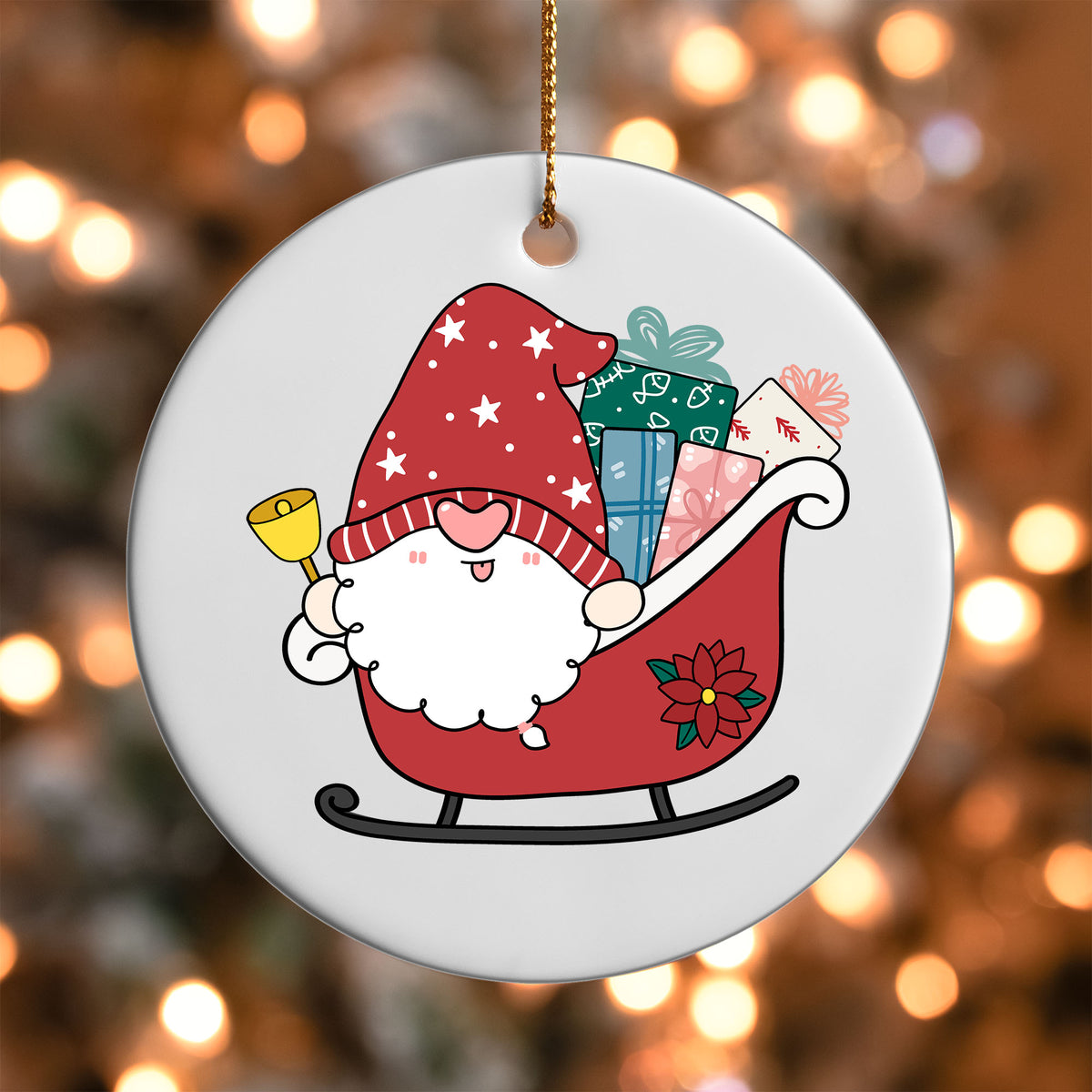 Santa Gnome Sleigh ornament UV DTF transfer on a round white ornament with a bokeh light background