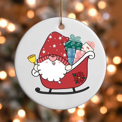 Santa Gnome Sleigh ornament UV DTF transfer on a round white ornament with a bokeh light background