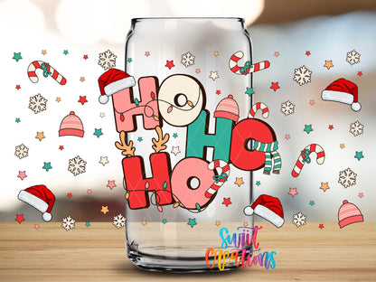 Close-up of the Ho Ho Ho Santa Hats UV DTF wrap on a clear glass can