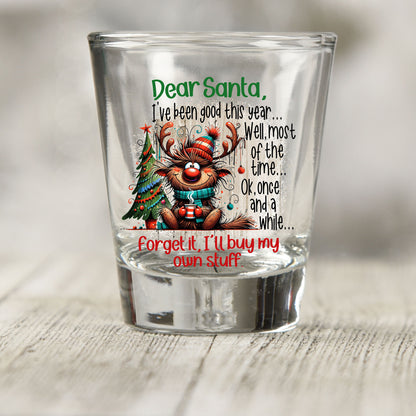 Santa I've Been Good Christmas shot glass UV DTF transfer with reindeer and Christmas tree artwork on a clear shot glass