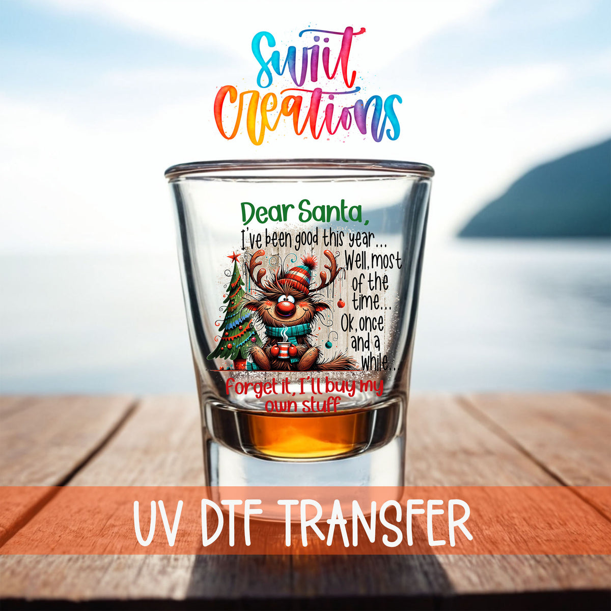 Santa I've Been Good Christmas shot glass UV DTF transfer on a filled shot glass on a dock by the water