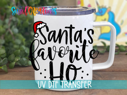 Santa's Favorite Ho UV DTF transfer on a white stainless steel mug with a lid