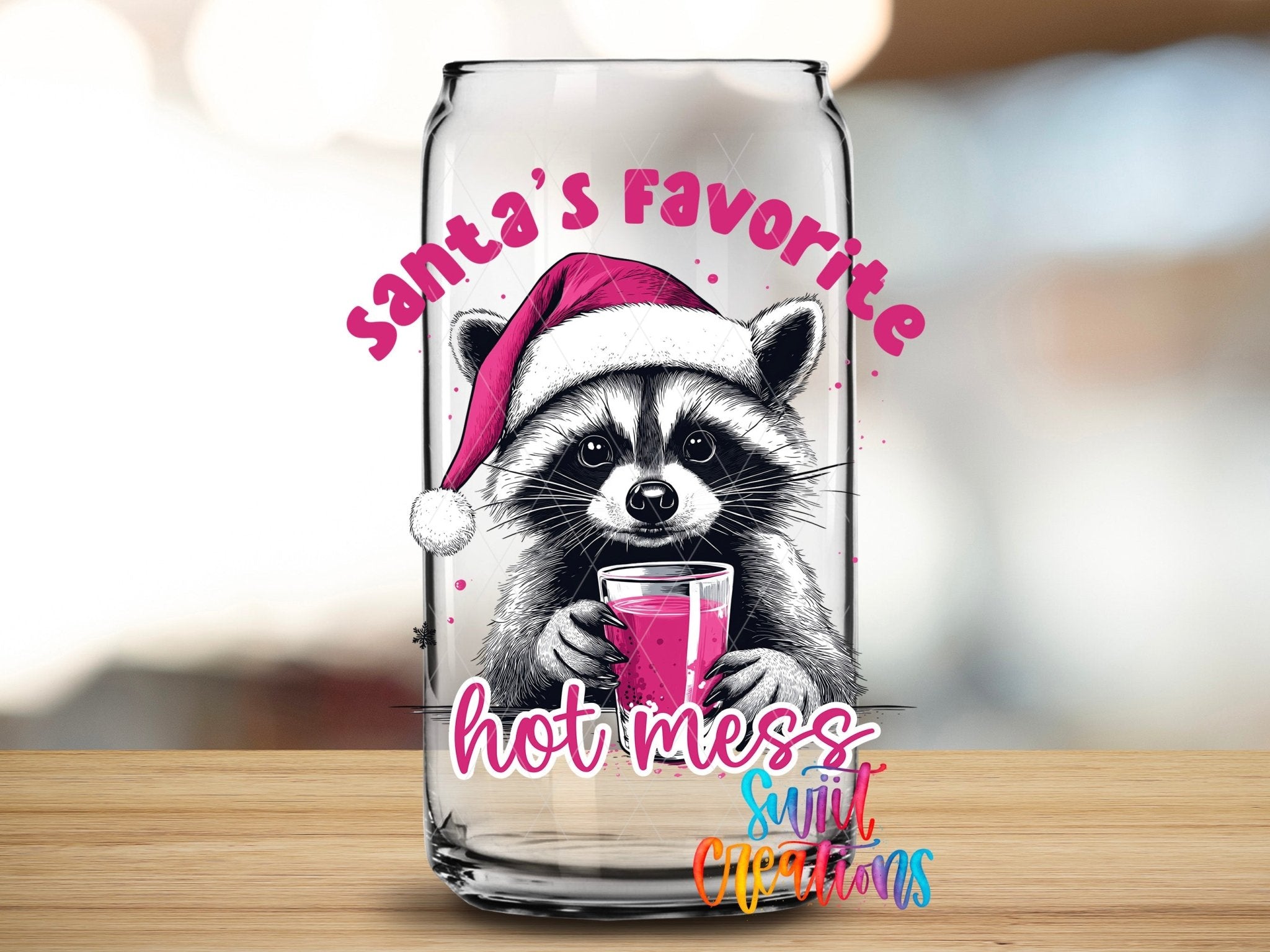 Swiit Creations UV DTF Santa’s Favorite Hot Mess Raccoon transfer applied to a clear glass can