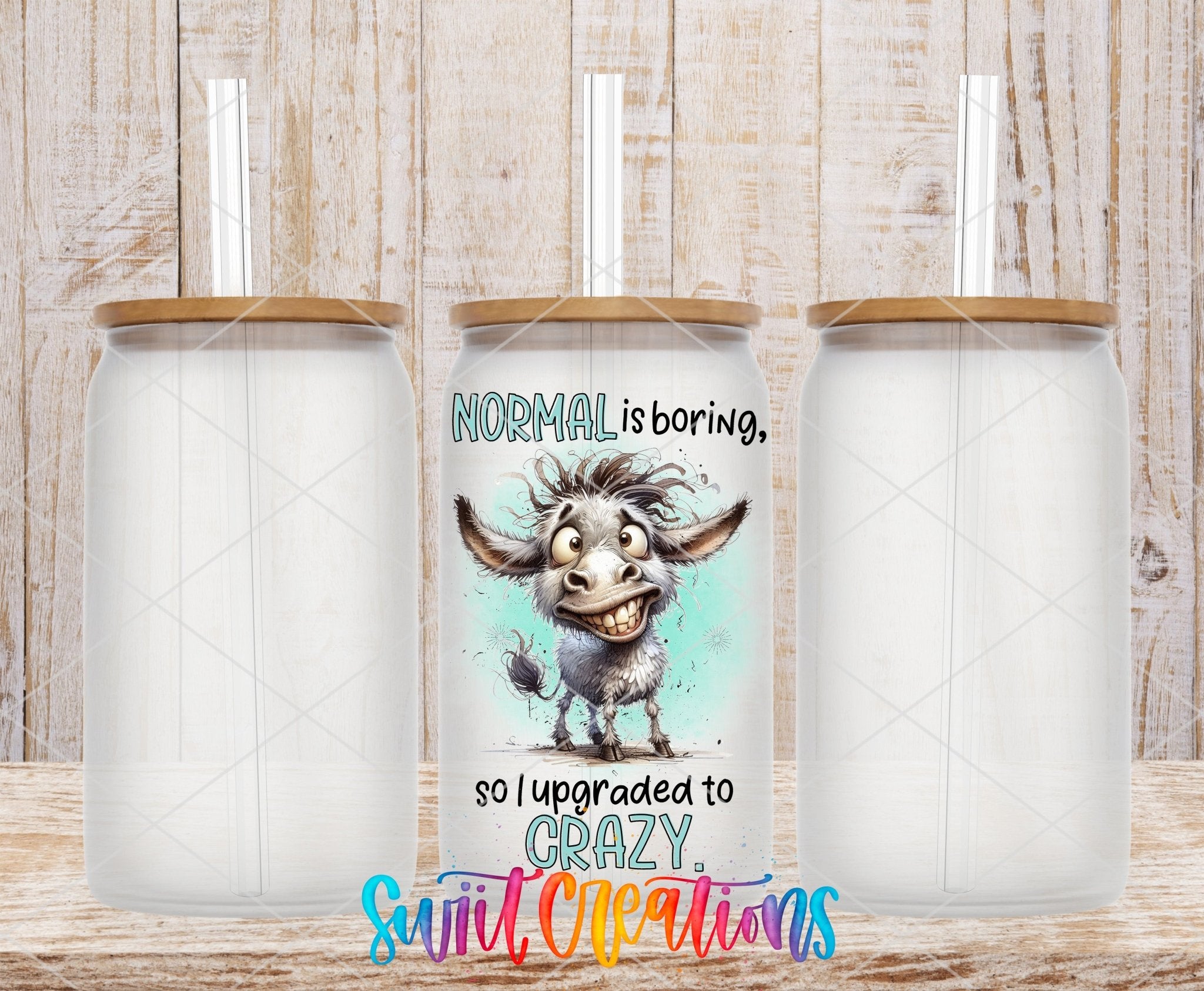Swiit Creations UV DTF Sarcastic and Sassy Normal is Boring transfer shown on a clear glass can set