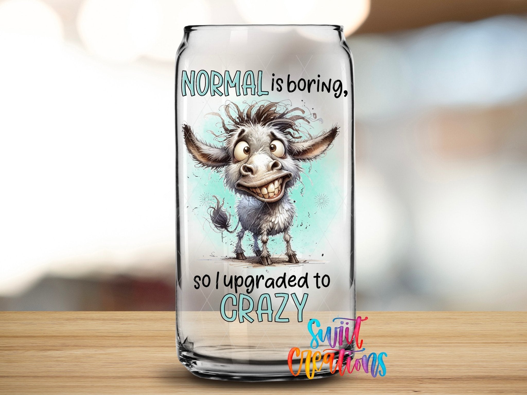 Swiit Creations UV DTF Sarcastic and Sassy Normal is Boring transfer applied to a clear glass can