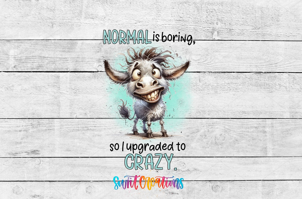 Normal Is Boring UV DTF transfer artwork on a white wood background