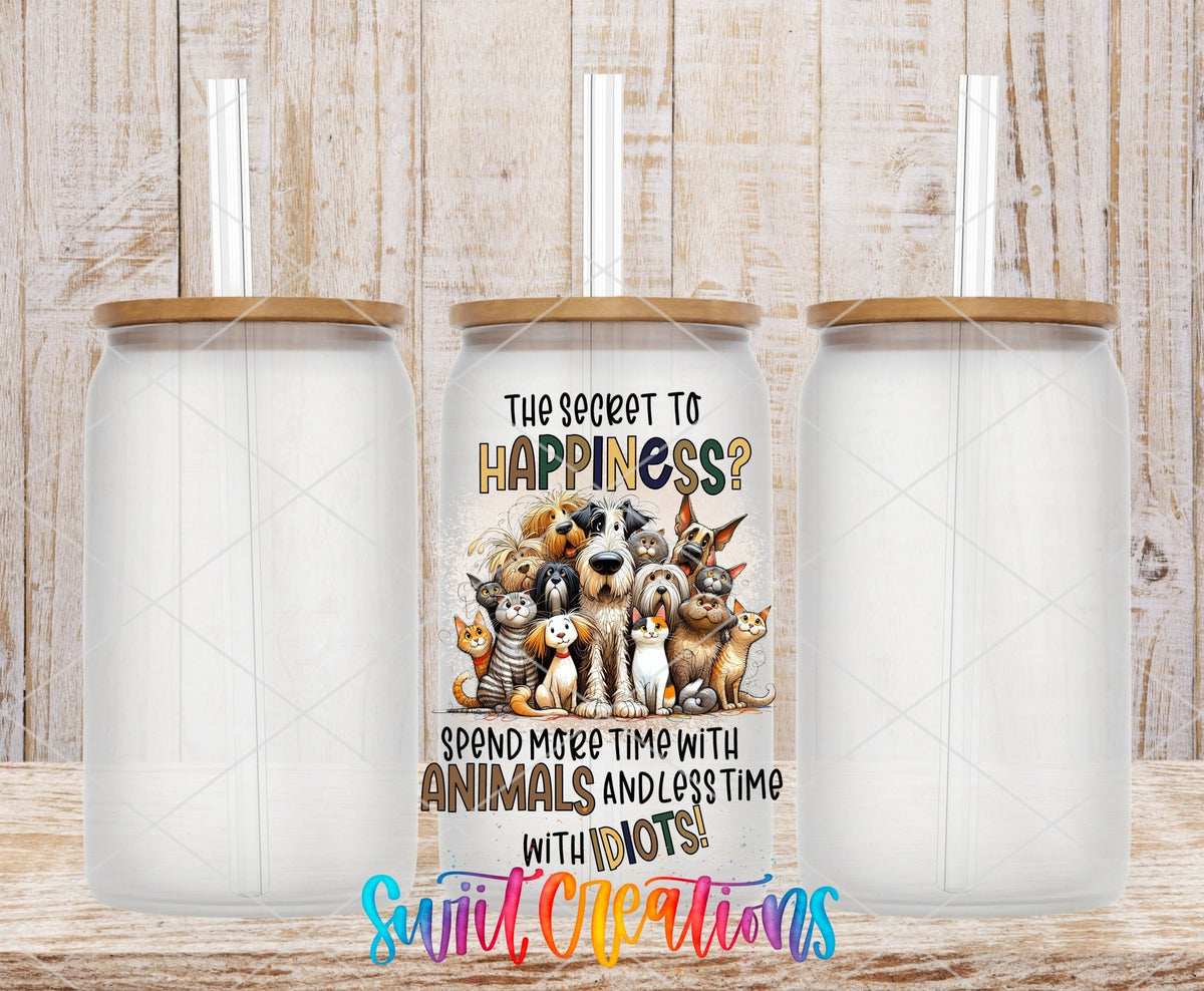 The Secret to Happiness UV DTF transfer on frosted glass cans with bamboo lids