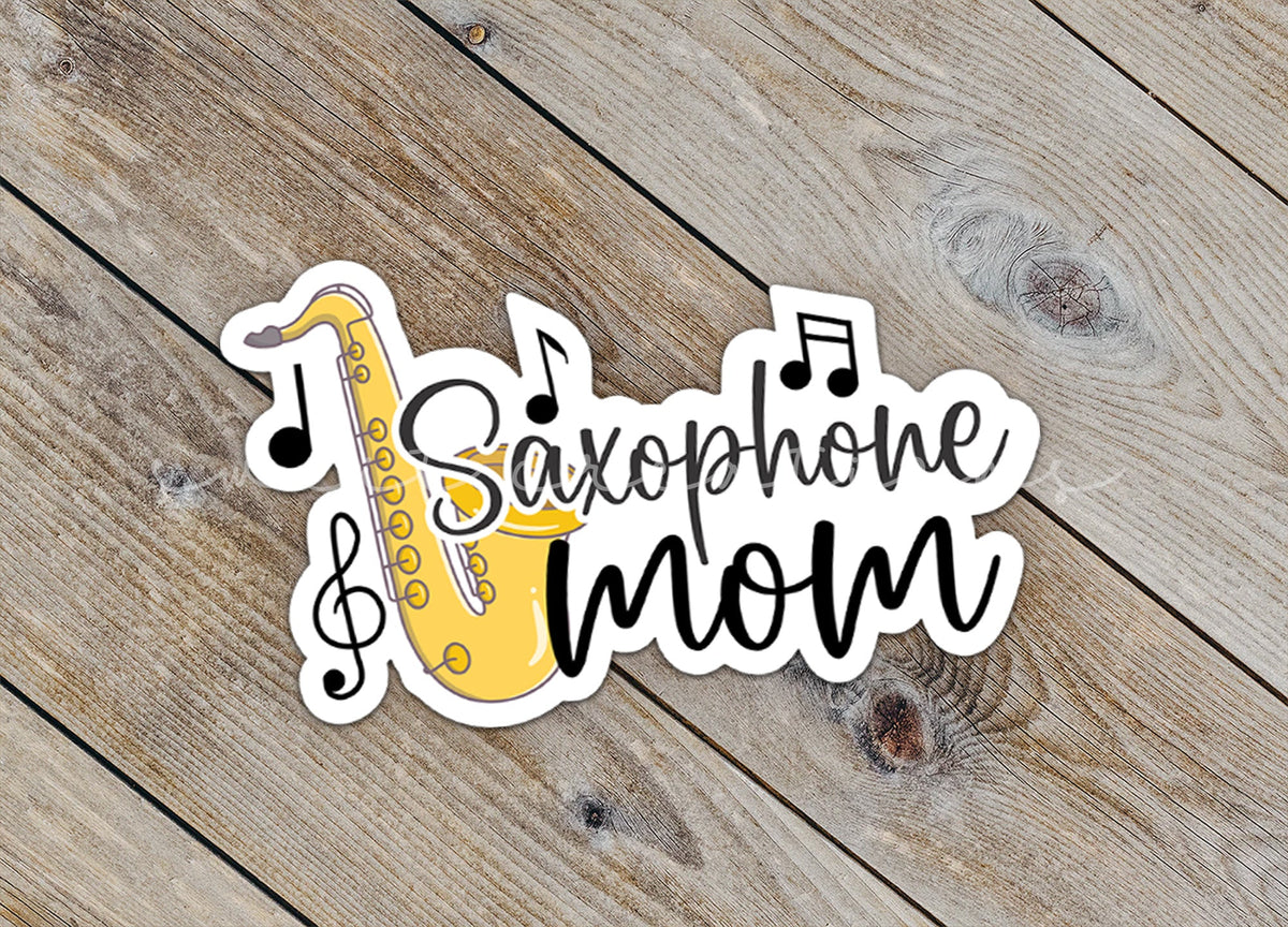 Close-up of the Saxophone Mom sticker on rustic wood