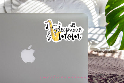 Saxophone Mom sticker on the lid of a silver laptop