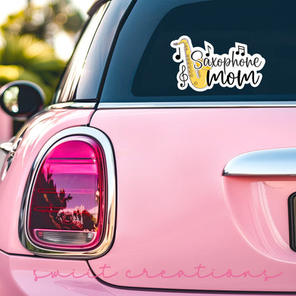 Saxophone Mom sticker on the back window of a pink car