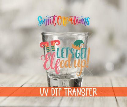 Let's Get Elfed Up Christmas elf shot glass UV DTF transfer shown on a clear shot glass with an orange UV DTF Transfer banner.