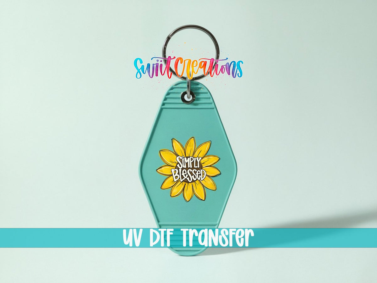 Simply Blessed UV DTF transfer on a teal motel keychain on a mint background
