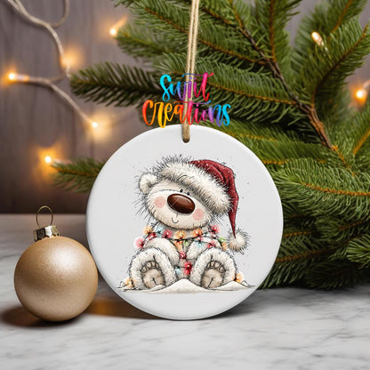 Sledding White Bear ornament UV DTF transfer on a hanging ornament with pine branches and a gold bauble