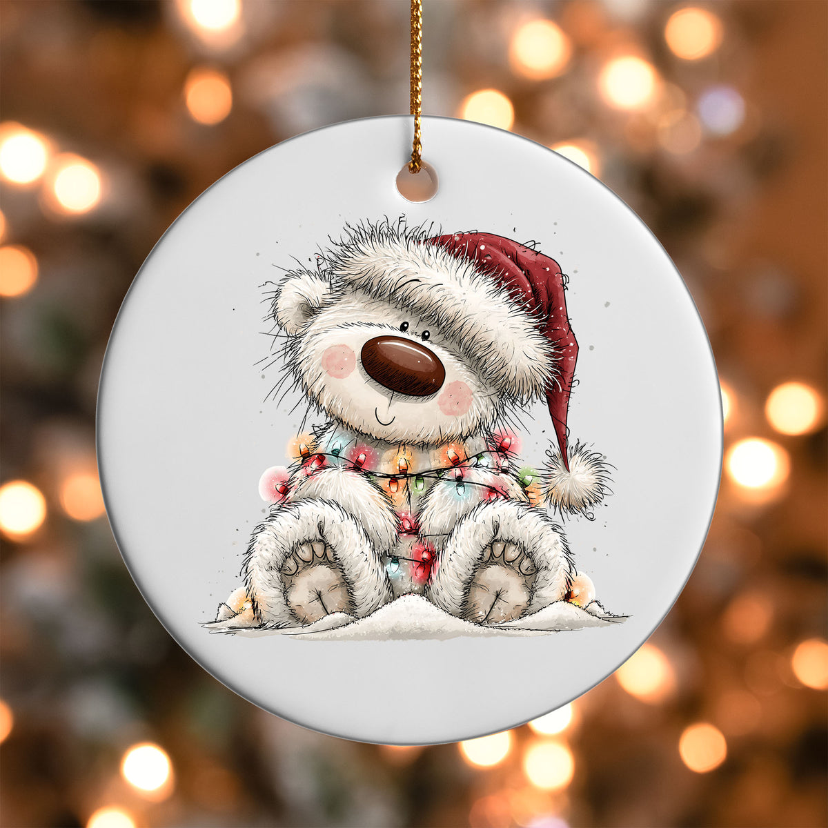 Sledding White Bear ornament UV DTF transfer on a round white ornament with a bokeh light background