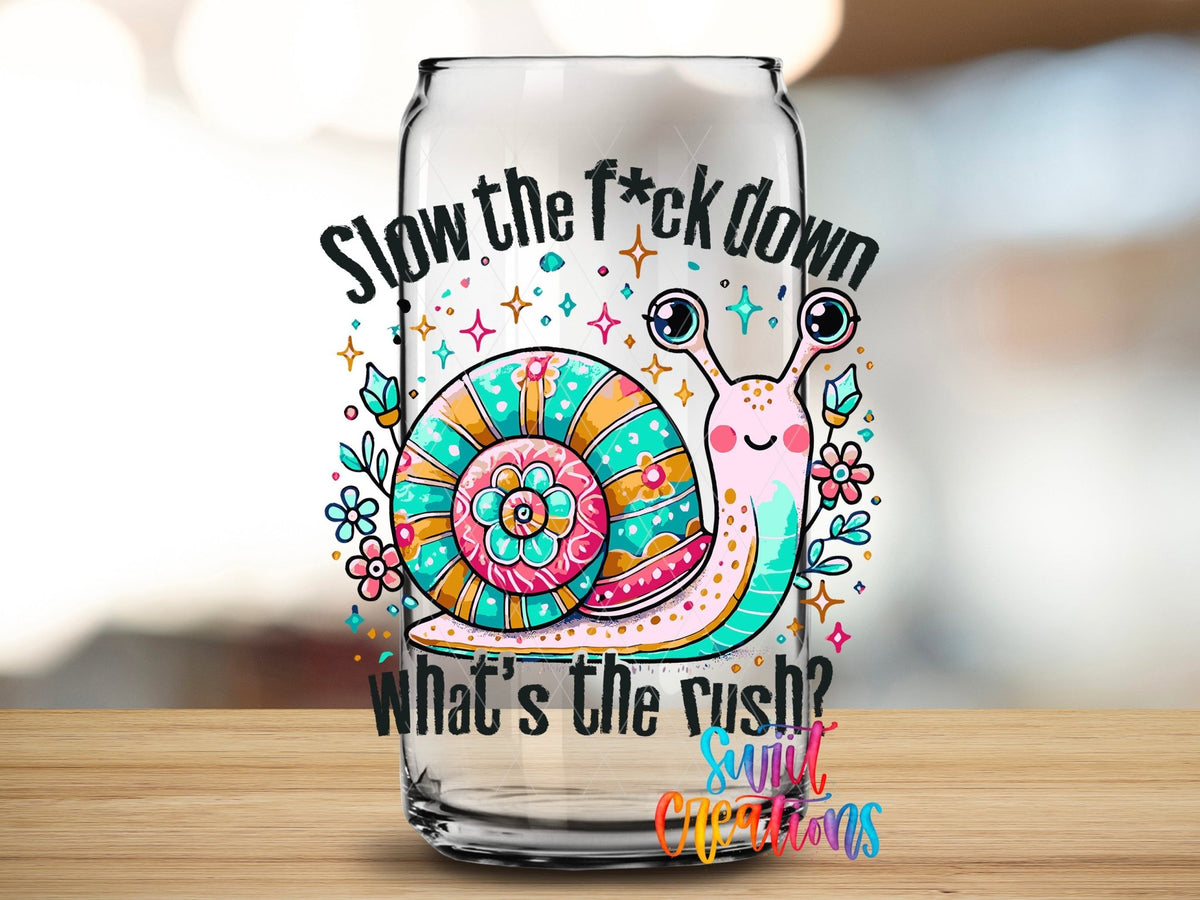 Close-up of the Slow the F*ck Down UV DTF transfer on a clear glass can