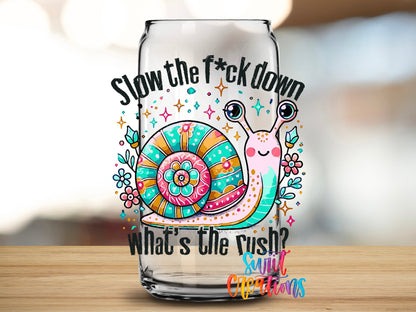 Close-up of the Slow the F*ck Down UV DTF transfer on a clear glass can