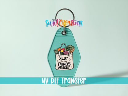 Sl*t for the Farmer's Market UV DTF transfer on a teal motel keychain on a mint background