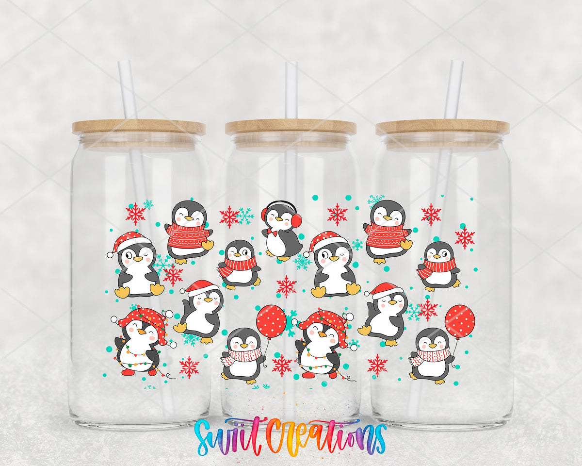 Christmas Penguins UV DTF wrap on three glass cans