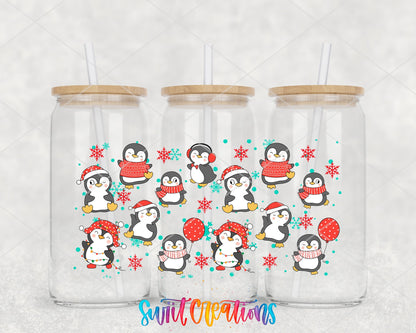 Christmas Penguins UV DTF wrap on three glass cans