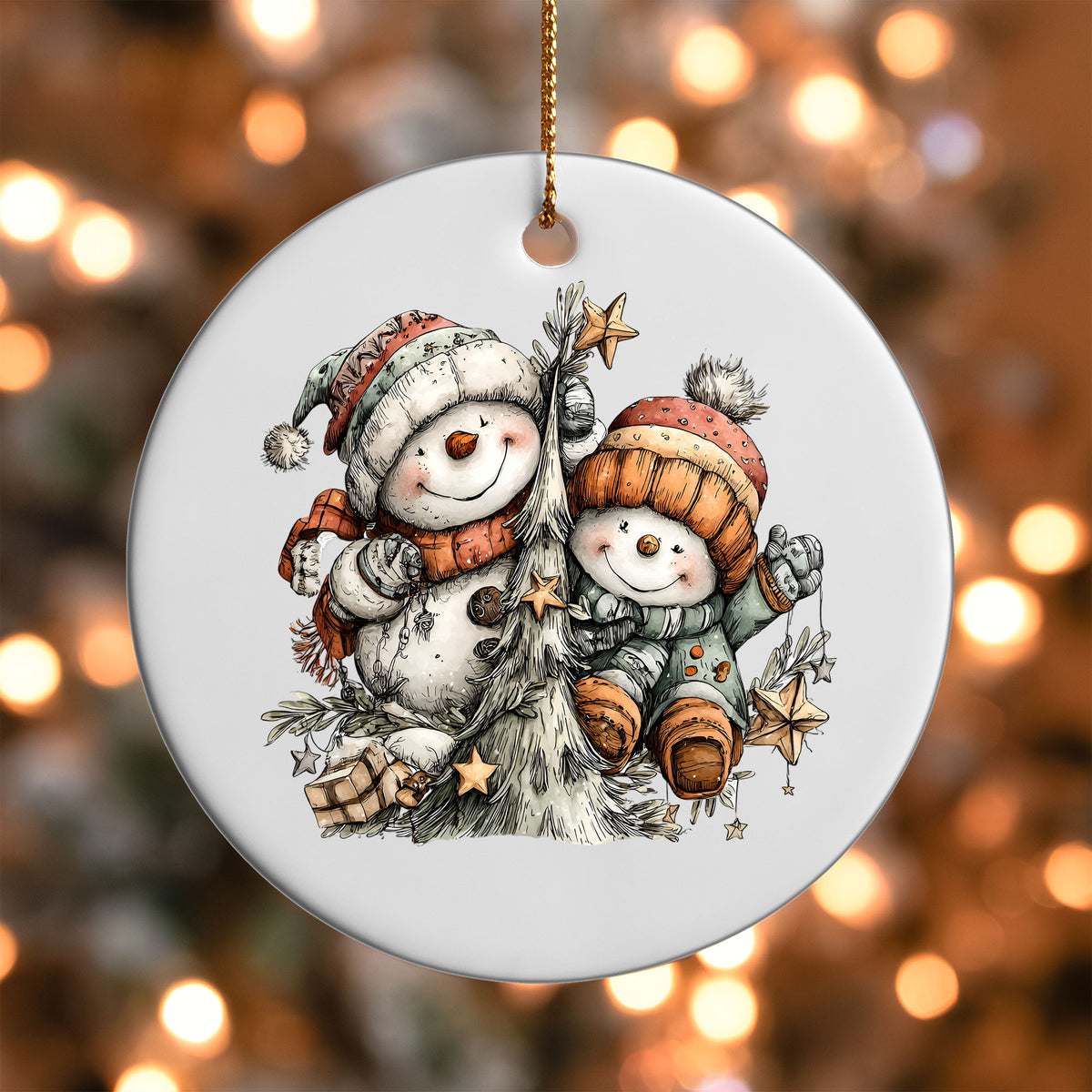 Snowman Friends ornament UV DTF transfer on a round white ornament with a bokeh light background