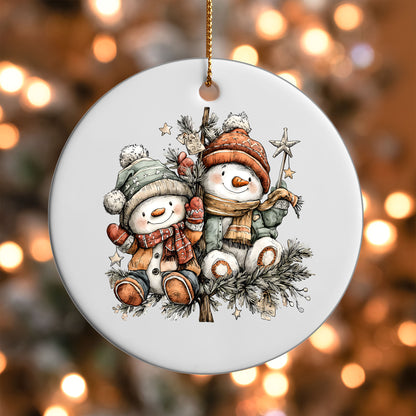 Snowman Friends ornament UV DTF transfer on a round white ornament with a bokeh light background