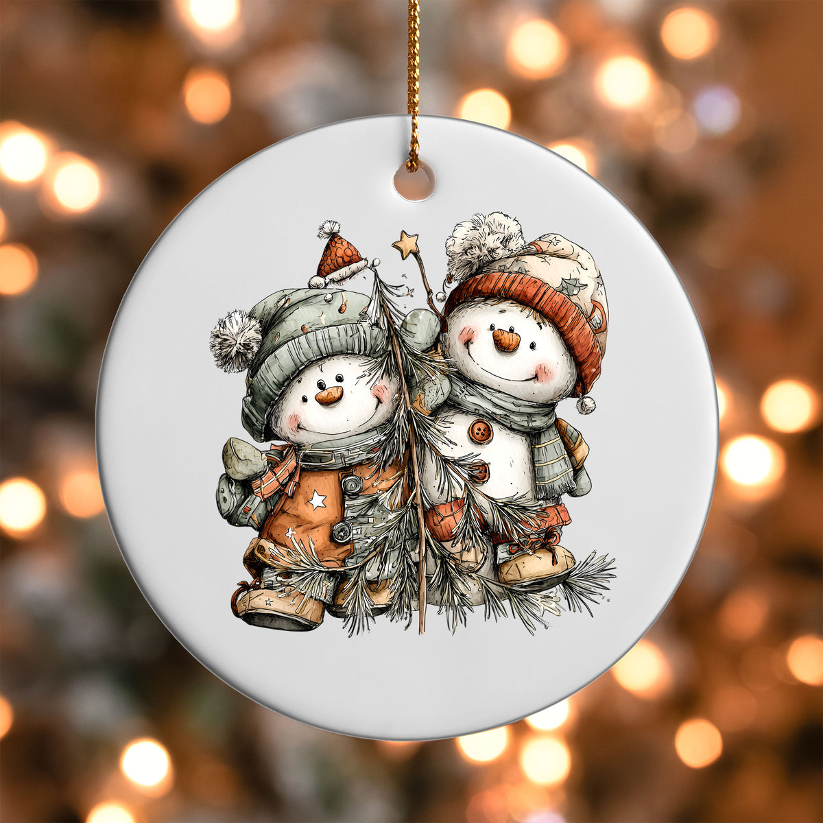 Snowman Friends ornament UV DTF transfer on a round white ornament with a bokeh light background
