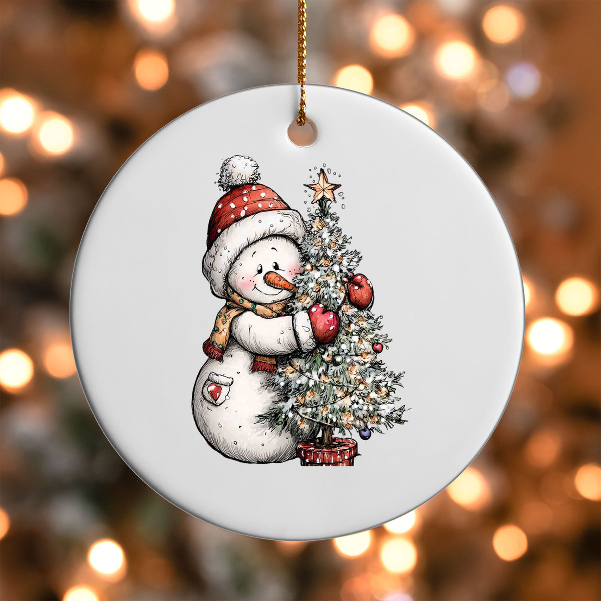 Snowman with Christmas Tree ornament UV DTF transfer on a round white ornament with a bokeh light background