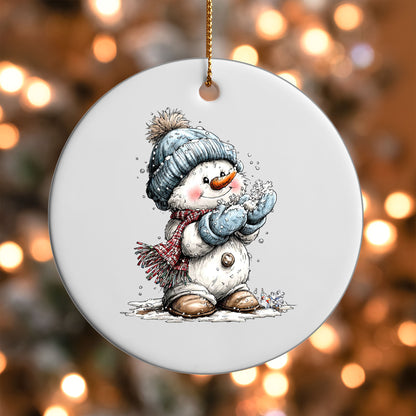 Snowman with Snowflake ornament UV DTF transfer on a round white ornament with a bokeh light background