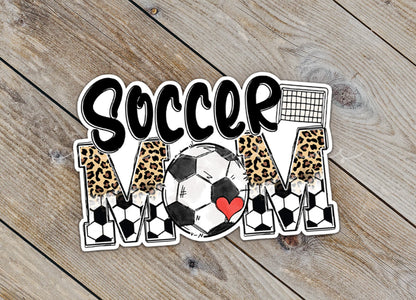 Close-up of the Soccer Mom sticker on rustic wood