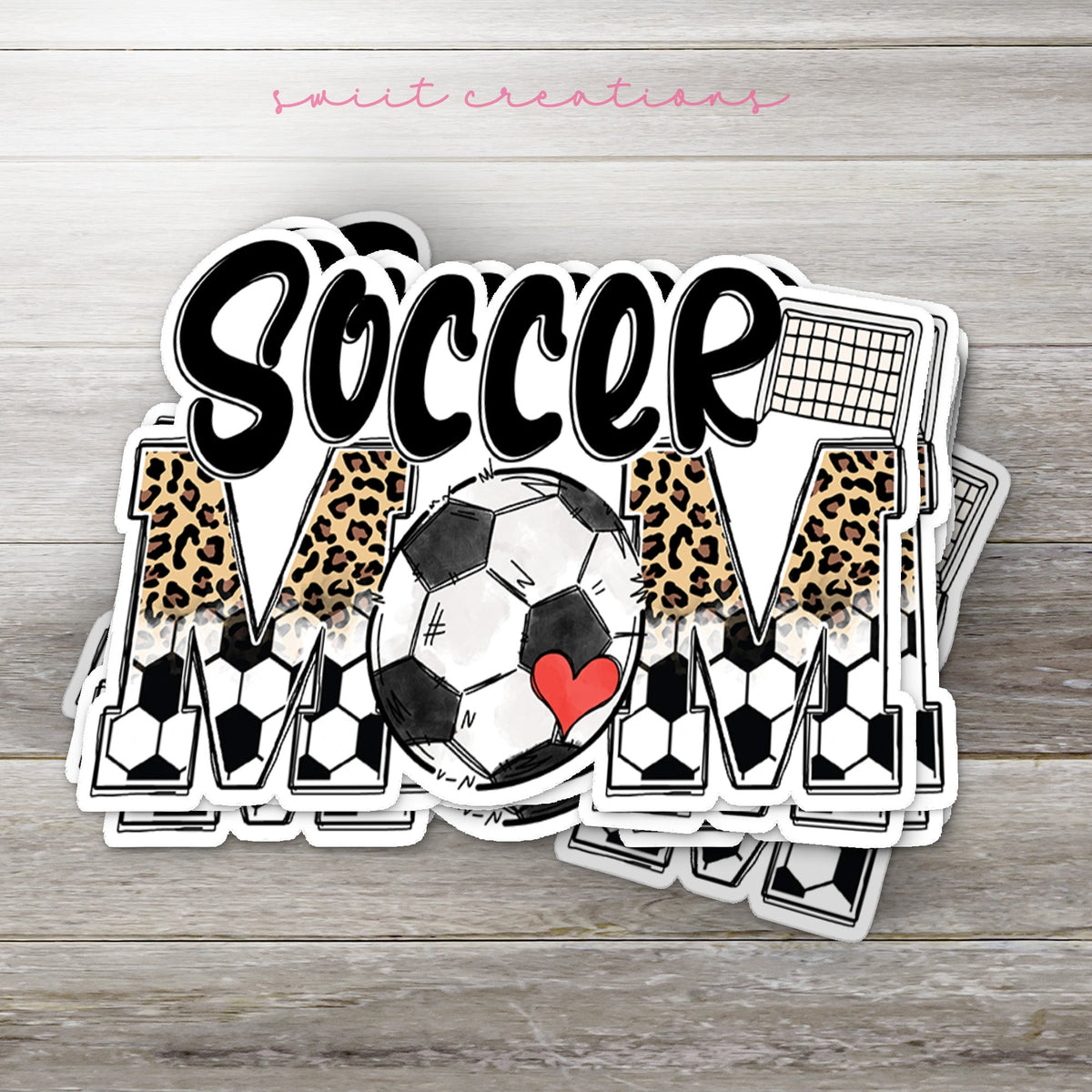 Stack of Soccer Mom glossy stickers on a gray wood table