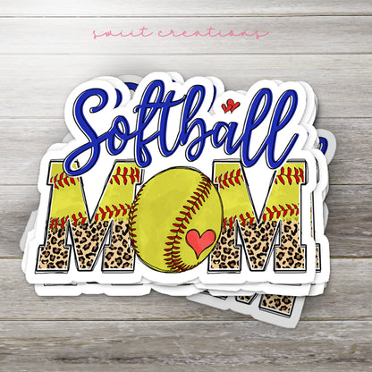 Stack of Softball Mom glossy stickers on a gray wood table