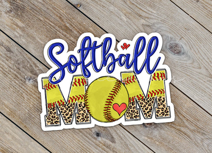 Close-up of the Softball Mom sticker on rustic wood
