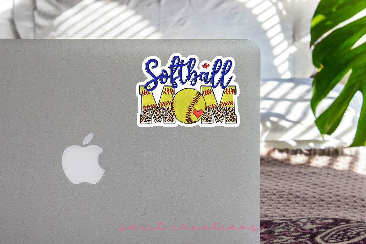 Softball Mom sticker on the lid of a silver laptop