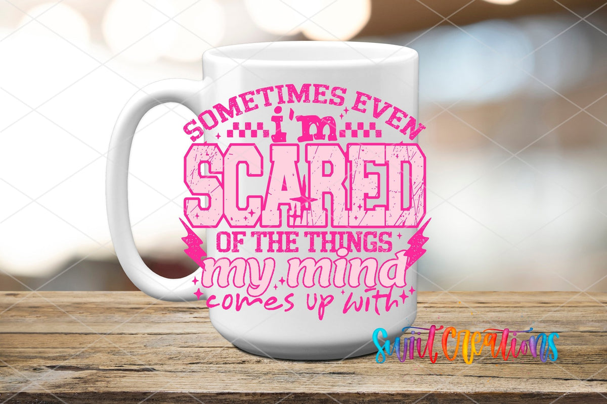 Sometimes Even I'm Scared pink letters UV DTF transfer on a white ceramic coffee mug