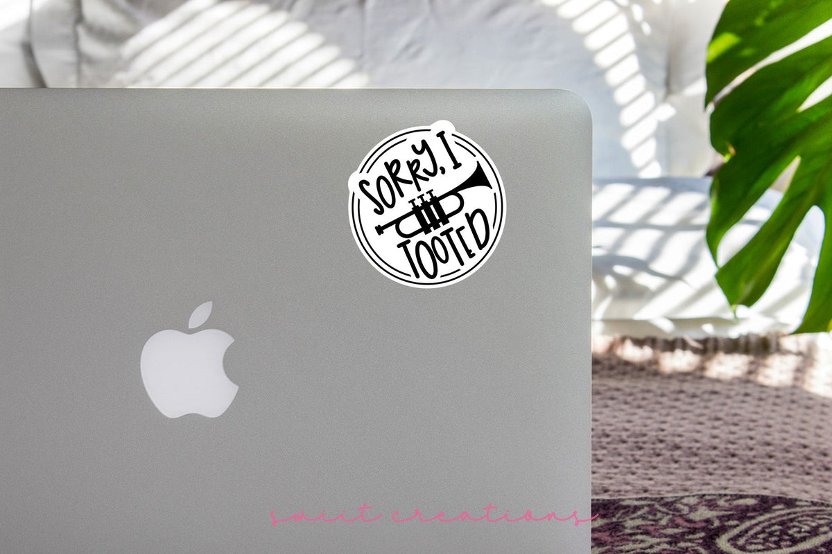 Sorry I Tooted Trumpet sticker on the lid of a silver laptop