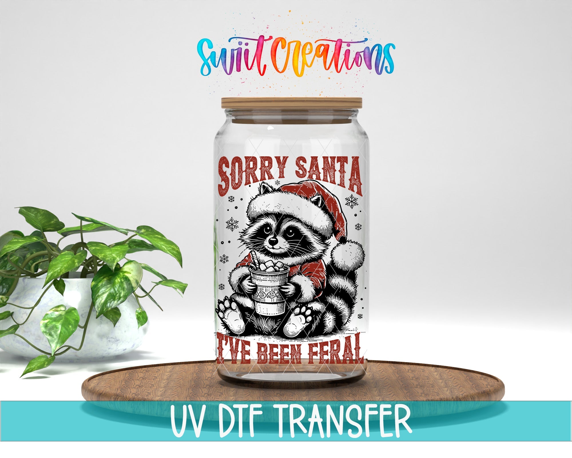 Swiit Creations UV DTF Feral Raccoon Christmas transfer displayed on a clear jar mockup